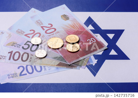 Israel, Israeli paper money, shekel banknotes and agorot coins as currency for exchange 142735716