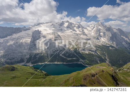 Majestic Snow Capped Dolomites Mountain Range with Turquoise Alpine Lake Majestic Snow Capped Dolomites Mountain Range with Turquoise Alpine Lake 142747281