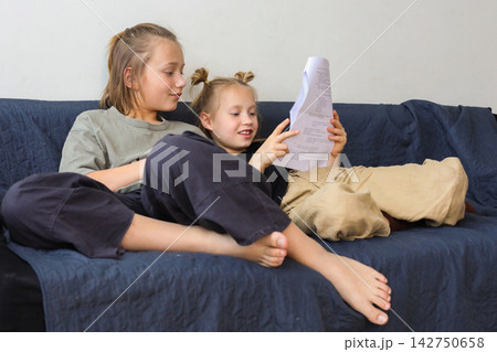 Adorable little girl and boy children having fun at home Adorable little girl and boy children having fun at home 142750658