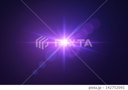 Bright light creating a starburst and optical lens flare effect on a dark background 142752091