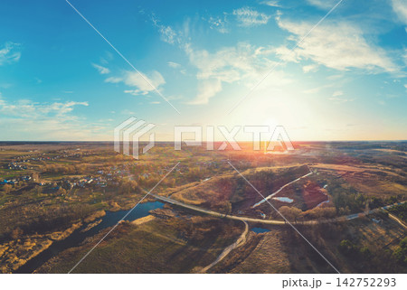 Spring rural landscape. Aerial view. View of the village, country road, and river Spring rural landscape. Aerial view. View of the village, country road, and river 142752293