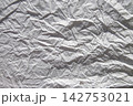 White crumpled wrinkled paper texture background, abstract rough paper surface with folds and shadows for design 142753021