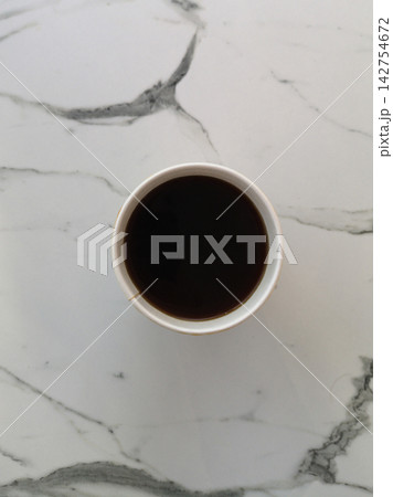 a cup of coffee on the table 142754672