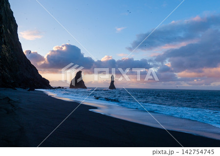 Sunrise view of Reynisfjara beach with its iconic sea stacks, located on the south coast of Iceland. Sunrise view of Reynisfjara beach with its iconic sea stacks, located on the south coast of Iceland. 142754745