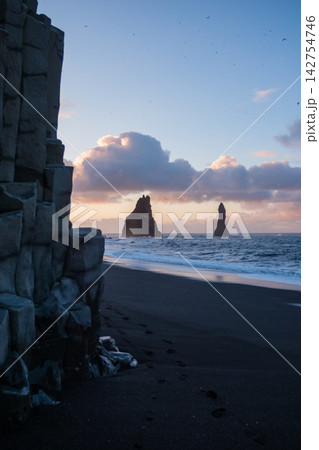 Sunrise view of Reynisfjara beach with its iconic sea stacks, located on the south coast of Iceland. Sunrise view of Reynisfjara beach with its iconic sea stacks, located on the south coast of Iceland. 142754746