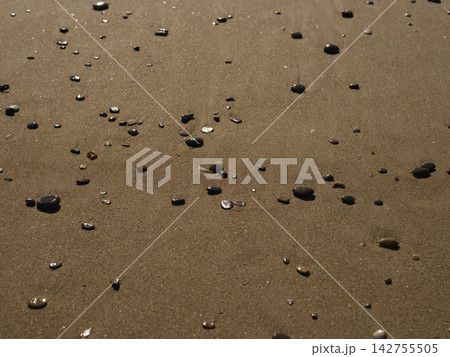 sands and pebbles on the beach 142755505