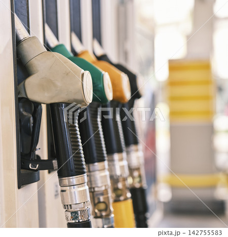 Petrol pump filling nozzles, Gas station in a service Petrol pump filling nozzles, Gas station in a service 142755583
