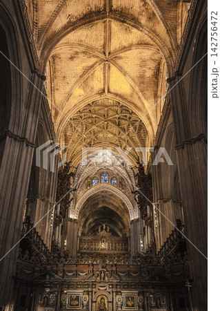 Gothic vaulted nave ceiling and gilded altarpiece inside Seville Cathedral, Spain Gothic vaulted nave ceiling and gilded altarpiece inside Seville Cathedral, Spain 142756472