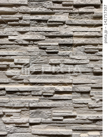 Decorative panels styled as brick stone and tile surfaces shown in a hardware store aisle for easy installation and professional finishing results Decorative panels styled as brick stone and tile surfaces shown in a hardware store aisle for easy installation and professional finishing results 142757307