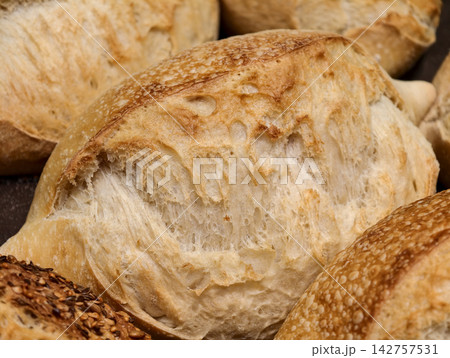 Fluffy white bread offered in a bakery, highlighting a soft loaf with a fresh texture prepared for customers looking for quality bread Fluffy white bread offered in a bakery, highlighting a soft loaf with a fresh texture prepared for customers looking for quality bread 142757531