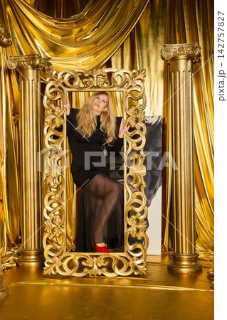 Vivid editorial shot showcasing model in glamorous outfit 142757827