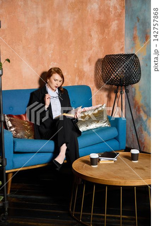 Professional observes report carefully in comfortable environment 142757868