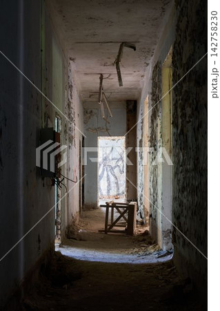 Abandoned corridor with stool and window moody urban decay 142758230