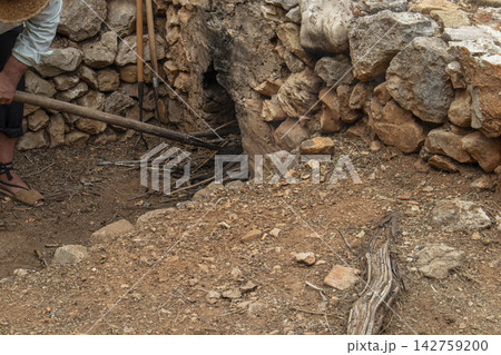 Traditional stone furnace oven for heating water in rural Spain during raisin drying Traditional stone furnace oven for heating water in rural Spain during raisin drying 142759200