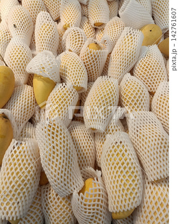 Wrapped fruit foam net packaging yellow fruit market display wrapped fruit Wrapped fruit foam net packaging yellow fruit market display wrapped fruit 142761607