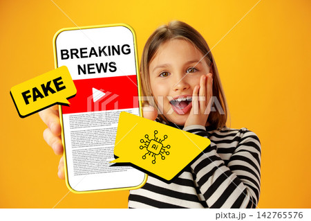 Girl holds smartphone showing fake news while looking surprised at home in the morning Girl holds smartphone showing fake news while looking surprised at home in the morning 142765576