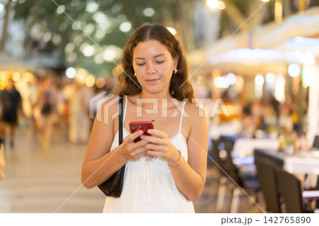 Woman using city map and looking for restaurants Woman using city map and looking for restaurants 142765890