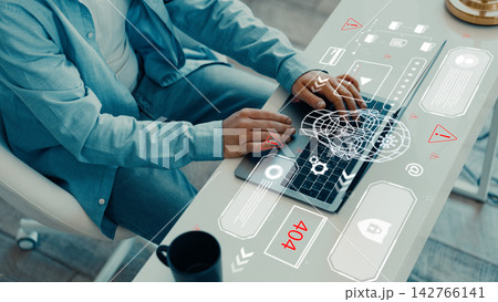 Using technology to create a deep fake while sitting at a desk in a modern office 142766141
