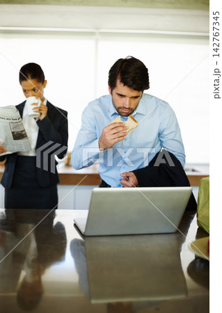 Home, breakfast and businessman reading of laptop, bread and woman with newspaper for update of stock market. Surprise, employee and auditor with email of report, analytics and rush for project 142767345