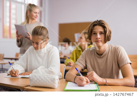 Group of school kids and teacher during lesson Group of school kids and teacher during lesson 142767467