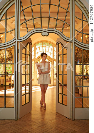 Woman, portrait and vintage manor for elegant fashion, clothes and luxury style at gala building. Window, female person and celebration of prom, beauty and wealth for charity ball at mansion Woman, portrait and vintage manor for elegant fashion, clothes and luxury style at gala building. Window, female person and celebration of prom, beauty and wealth for charity ball at mansion 142767984