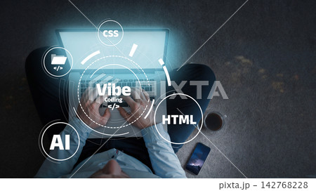 Working on vibe coding during nighttime while using a laptop and coffee nearby Working on vibe coding during nighttime while using a laptop and coffee nearby 142768228