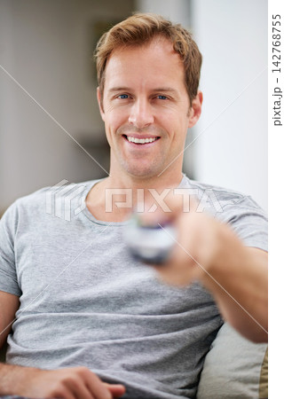 Portrait, smile and man watching tv in home living room sofa for movie, video or stream show to relax. Face, happy person and television remote control in lounge for film, news or media entertainment 142768755