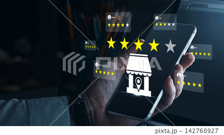 Customer feedback rating displayed on a smartphone showing five stars and business icon 142768927
