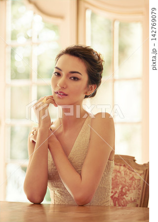 Woman, portrait and asian in luxury mansion with elegant clothes for wedding party. Bride, aristocratic home and thoughtful for fashion event, makeup and confidence waiting for guests or smiling Woman, portrait and asian in luxury mansion with elegant clothes for wedding party. Bride, aristocratic home and thoughtful for fashion event, makeup and confidence waiting for guests or smiling 142769079