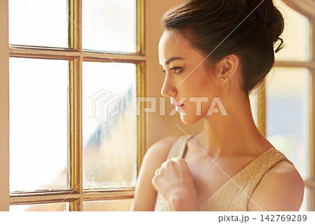 Woman, beauty and luxury in house with fancy, elegant and classy in fashion by window for wealth aesthetic. Female person, style and vintage mansion for gala, thinking or event with confidence Woman, beauty and luxury in house with fancy, elegant and classy in fashion by window for wealth aesthetic. Female person, style and vintage mansion for gala, thinking or event with confidence 142769289