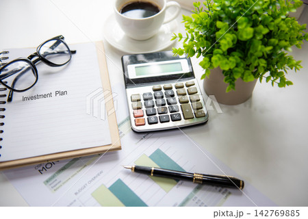 Retirement investment planning with saving, calculate and notebook for future financial security. Financial Wellness for retirement Concept Retirement investment planning with saving, calculate and notebook for future financial security. Financial Wellness for retirement Concept 142769885