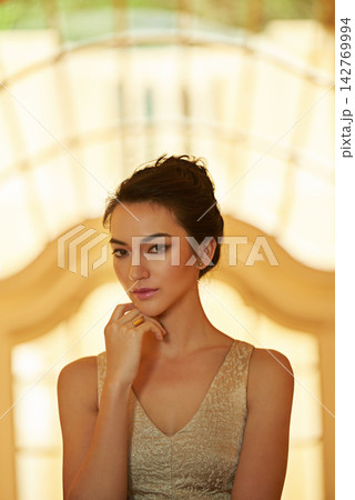 Fashion, portrait and woman in elegant dress for luxury, event or dinner date with classy golden outfit. Female person, calm and confident in trendy clothes for gala, glamour and beauty or style Fashion, portrait and woman in elegant dress for luxury, event or dinner date with classy golden outfit. Female person, calm and confident in trendy clothes for gala, glamour and beauty or style 142769994