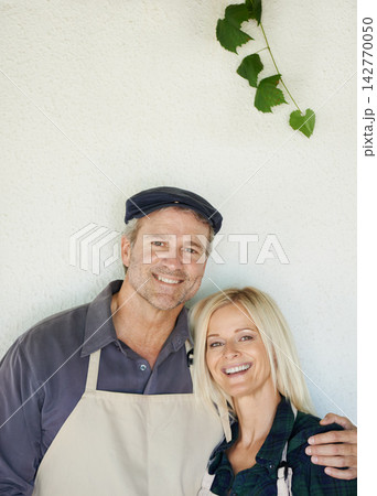 Wall, portrait and couple with apron, team and partnership in small business, growth and market. White background, man and woman with happiness for industry, owner and entrepreneur and career 142770050