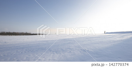 Landscape, snow and winter in countryside with environment, blue sky and sunshine in nature. Park, cold and travel for holiday, trip and vacation in Switzerland for adventure with mock up space Landscape, snow and winter in countryside with environment, blue sky and sunshine in nature. Park, cold and travel for holiday, trip and vacation in Switzerland for adventure with mock up space 142770374