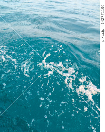 Ripple blue sea water texture with white foam Ripple blue sea water texture with white foam 142771196