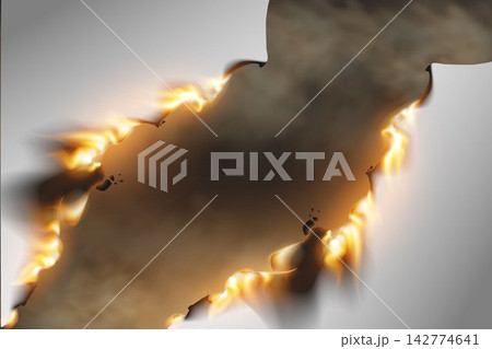 Burning paper creating an abstract dark frame surrounded by vibrant flames and smoke 142774641