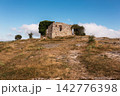 ruins of a house in La Mussara ,Tarragona, Spain, above everything on a hill with a cliff 142776398