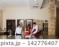 Chefs preparing food in restaurant kitchen during cooking course 142776407
