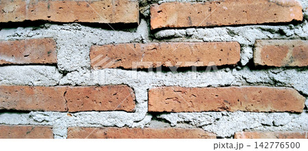 Red brick wall texture background with cement mortar Red brick wall texture background with cement mortar 142776500