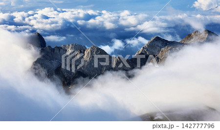 mountains covered with snow mountains covered with snow 142777796