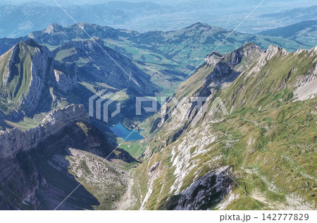 mountain peaks above the clouds mountain peaks above the clouds 142777829