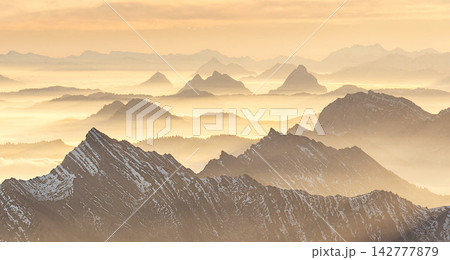 mountains in fog at sunset mountains in fog at sunset 142777879