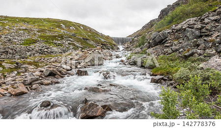 waterfall in the mountains 142778376