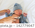 Newborn baby receiving medical checkup with stethoscope 142779047