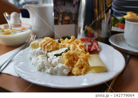 Hotel Breakfast Plate with Scrambled Eggs and Cottage Cheese 142779064