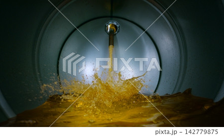 Gasoline Flowing and Splashing inside a Barrel, Unique Angle Shot from inside the Container 142779875