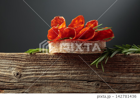 Sandwich with thin slices chorizo sausages. Sandwich with thin slices chorizo sausages. 142781436