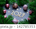 New Year background with 2027 on a blue background with Christmas decorations. 142785353