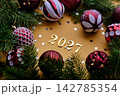 Yellow New Year's background with the number of the coming year 2027. 142785354