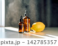 Natural skincare essence with lemon and dropper bottles 142785357